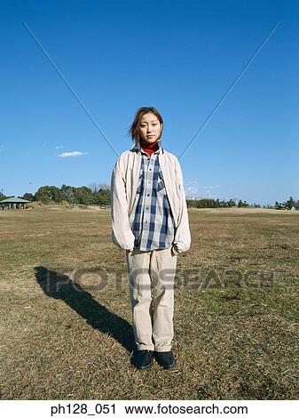 Two young women standing View Large Photo Image Stock Image - Two young women standing . Fotosearch