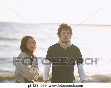 Stock Photo - Young couple at the beach. Fotosearch