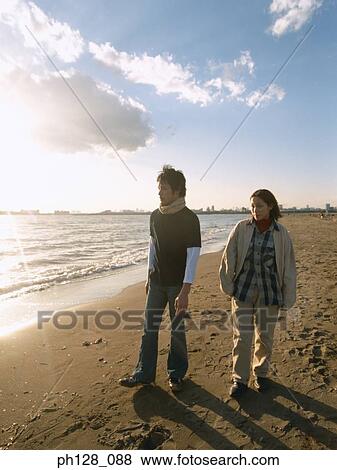 Stock Photo - Young couple at the beach. Fotosearch