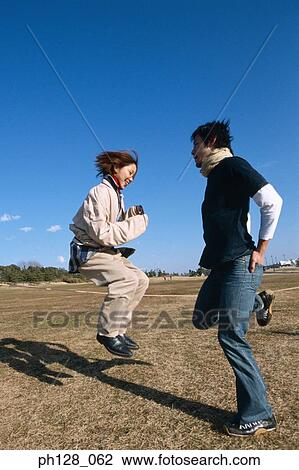 Stock Image - Young couple hopping . Fotosearch
