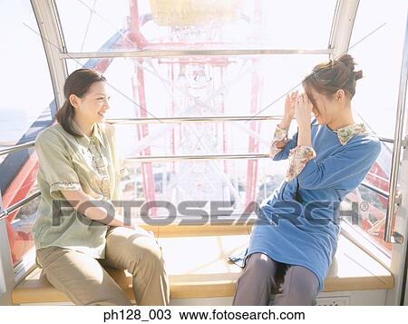 Young woman taking photo for her friend View Large Photo Image Stock Image - Young woman taking photo for her friend. Fotosearch