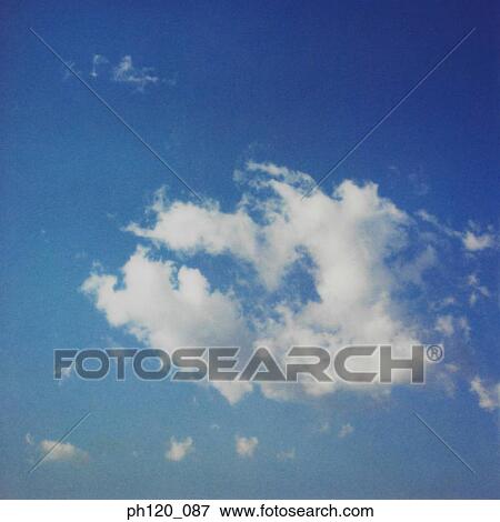 Cloudy blue sky View Large Photo Image Stock Photo - Cloudy blue sky. Fotosearch