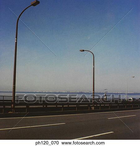Empty road and street lamps View Large Photo Image Stock Image - Empty road and street lamps. Fotosearch