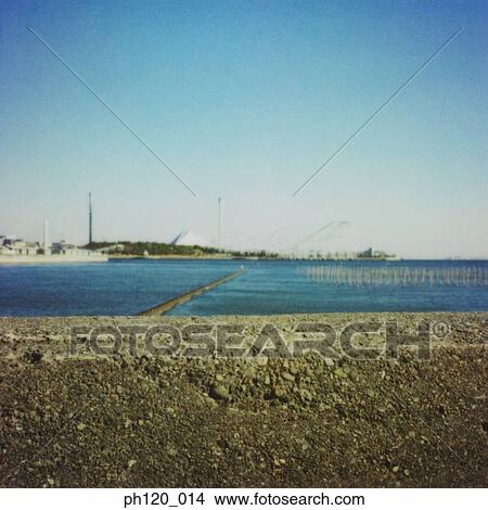 Picture - Industrial estate across the sea. Fotosearch