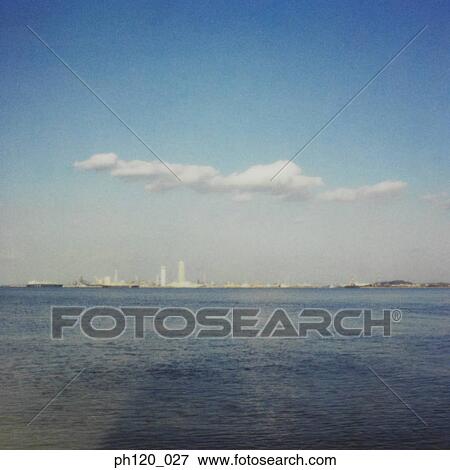 Stock Photo - Industrial estate across the sea. Fotosearch