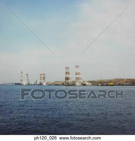 Industrial estate across the sea View Large Photo Image Stock Photograph - Industrial estate across the sea. Fotosearch