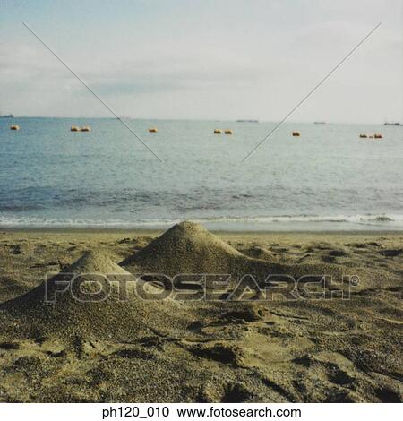 Piles of sand at beach View Large Photo Image Stock Image - Piles of sand at beach. Fotosearch
