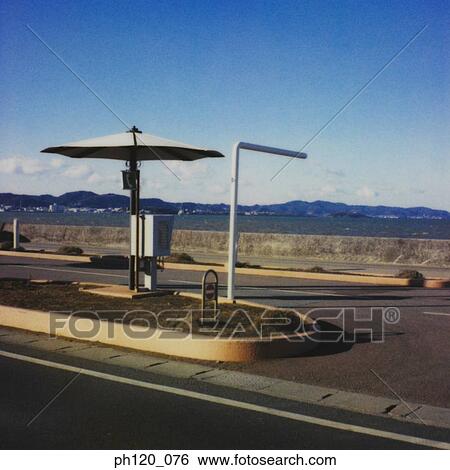 Stock Photograph - Telephone booth at junction. Fotosearch