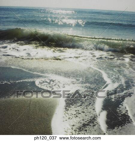 Wave rushing on to Shore View Large Photo Image Stock Photo - Wave rushing on to Shore . Fotosearch