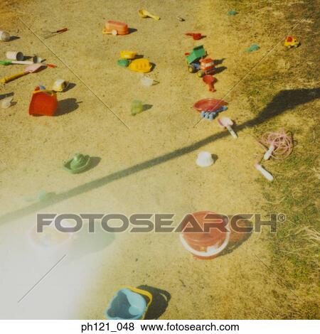 Stock Photo - Buckets and spades on sand. Fotosearch