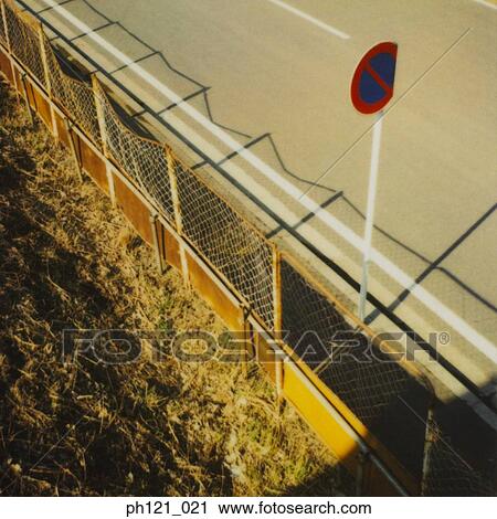 Dented road sign by the roadside View Large Photo Image Stock Image - Dented road sign by the roadside. Fotosearch