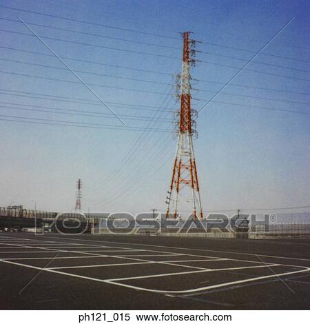 Stock Photography - Electrical pylon and lines against blue sky. Fotosearch