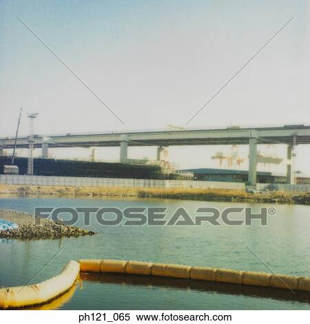 Stock Photography - Elevated highway by the river. Fotosearch