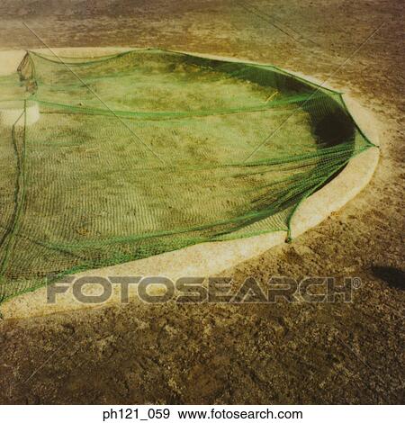Stock Photo - Net covering circular structure on ground. Fotosearch