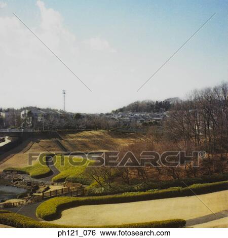 Stock Photograph - Park before the canal and estate. Fotosearch