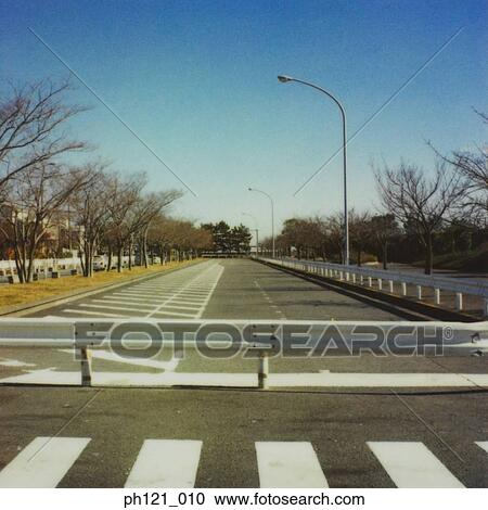 Stock Image - Pedestrian crossing, painted road markings, close-up . Fotosearch