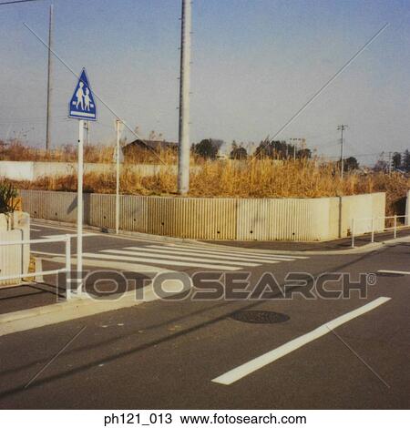 Stock Image - Pedestrian crossing, painted road markings, close-up . Fotosearch