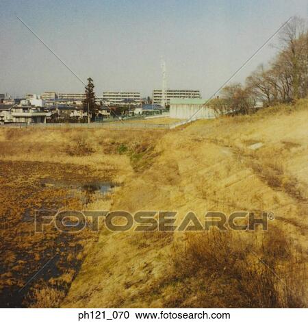 Polluted and drying canal View Large Photo Image Stock Image - Polluted and drying canal. Fotosearch