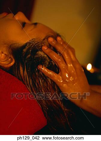 Woman receiving a back massage View Large Photo Image Stock Image - Woman receiving a back massage. Fotosearch
