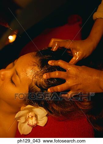 Woman receiving a back massage View Large Photo Image Stock Image - Woman receiving a back massage. Fotosearch
