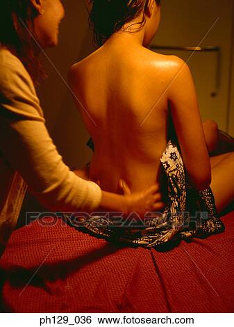 Woman receiving a back massage View Large Photo Image Stock Photograph - Woman receiving a back massage. Fotosearch