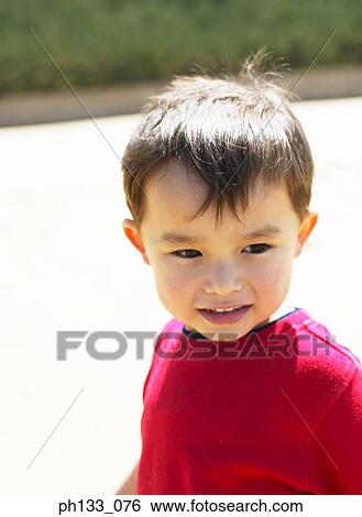 Young boy looking & smiling View Large Photo Image Stock Photograph - Young boy looking & smiling. Fotosearch