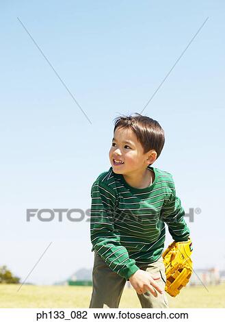 Young boy playing baseball View Large Photo Image Stock Image - Young boy playing baseball. Fotosearch