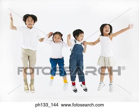 Young children smiling & jumping View Large Photo Image Picture - Young children smiling & jumping. Fotosearch