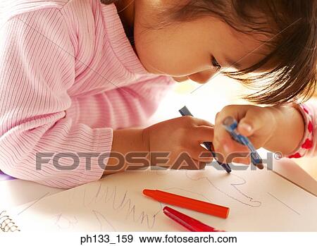 Young girl drawing on paper View Large Photo Image Stock Photo - Young girl drawing on paper. Fotosearch