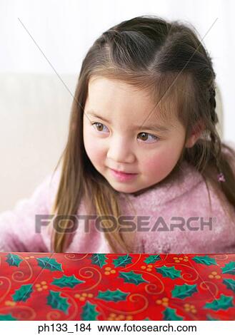 Young girl with gift View Large Photo Image Picture - Young girl with gift. Fotosearch