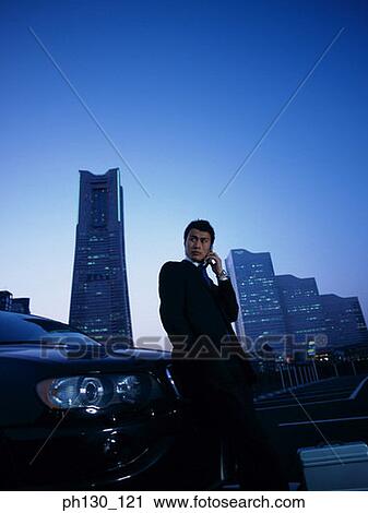 Asian Man on the cell phone View Large Photo Image Stock Image - Asian Man on the cell phone. Fotosearch