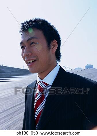Stock Image - Asian man smiling. Fotosearch