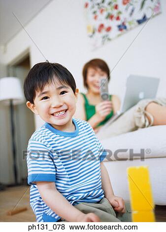 Stock Photo - Asian child playing with blocks. Fotosearch