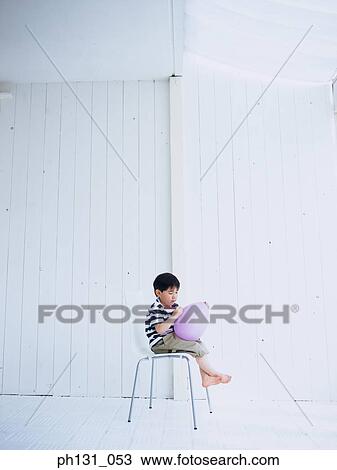 Asian child writing on a balloon View Large Photo Image Stock Image - Asian child writing on a balloon. Fotosearch