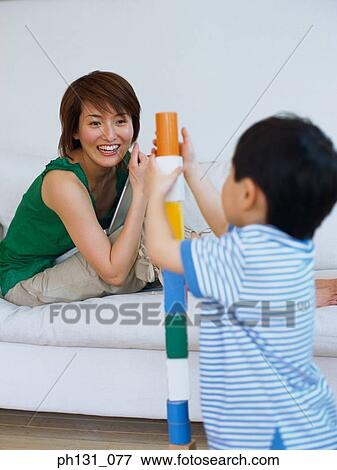Stock Photo - Asian mother and son playing with blocks. Fotosearch