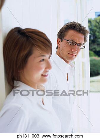 Man looking at Asian woman View Large Photo Image Stock Image - Man looking at Asian woman. Fotosearch