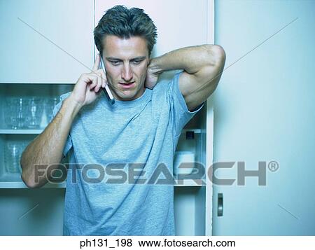 Caucasian man talking on the phone View Large Photo Image Stock Photo - Caucasian man talking on the phone. Fotosearch