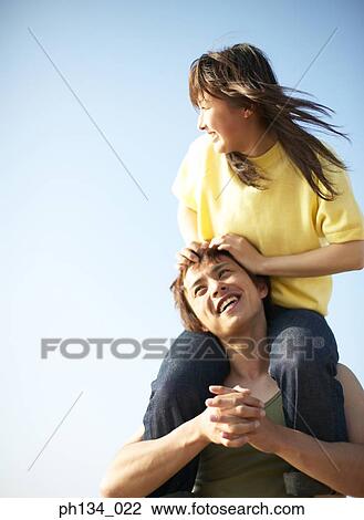 Young couple having fun View Large Photo Image Stock Image - Young couple having fun. Fotosearch