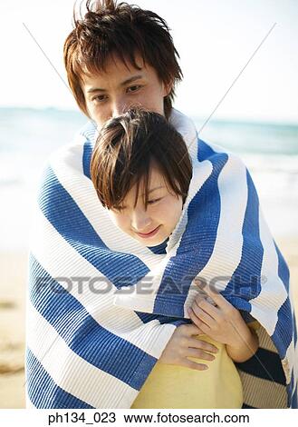 Young couple wrapped in towel View Large Photo Image Stock Image - Young couple wrapped in towel. Fotosearch
