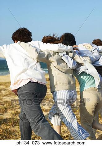Young friends running together View Large Photo Image Stock Image - Young friends running together. Fotosearch