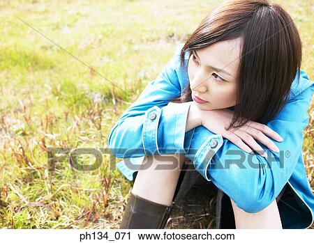 Young woman sitting View Large Photo Image Stock Image - Young woman sitting. Fotosearch