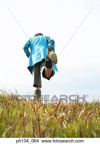 Young woman walking View Large Photo Image Picture - Young woman walking. Fotosearch