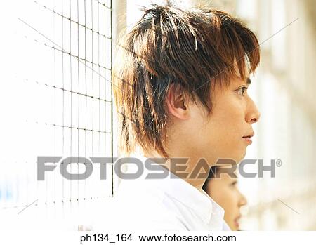 Picture - Young couple looking ahead. Fotosearch