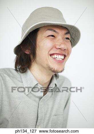 Young man laughing View Large Photo Image Stock Photo - Young man laughing. Fotosearch