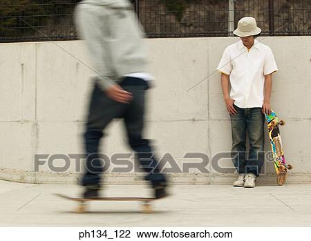 Young man skating View Large Photo Image Stock Image - Young man skating. Fotosearch