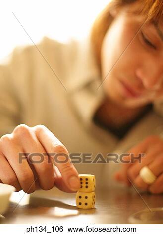 Young man with dice View Large Photo Image Stock Photograph - Young man with dice. Fotosearch