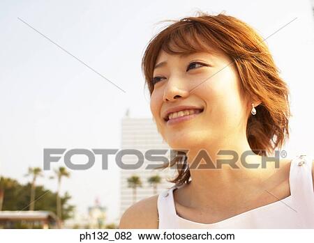 Young woman smiling View Large Photo Image Stock Image - Young woman smiling. Fotosearch