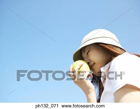 Young woman with fruit View Large Photo Image Stock Image - Young woman with fruit. Fotosearch