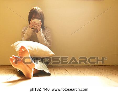 Stock Photograph - Young woman drinking from a bowl. Fotosearch