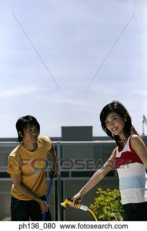 Young couple cleaning View Large Photo Image Stock Image - Young couple cleaning. Fotosearch